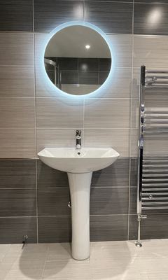 New basin, tap and light-up mirror