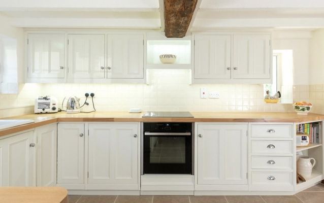 Painted kitchen cabinets and wooden worktops